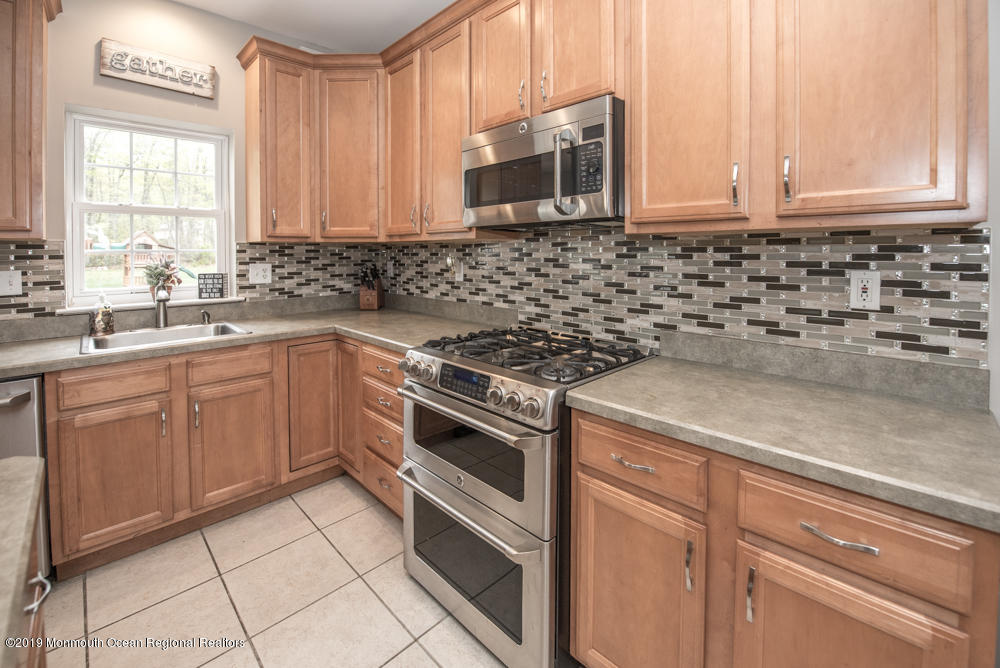 11 Round Hill Road Jackson, NJ 08527 - Photo 25 of 69 a kitchen with cabinets appliances and a window