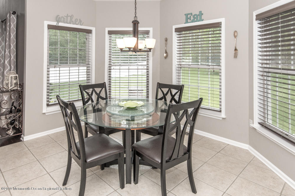 11 Round Hill Road Jackson, NJ 08527 - Photo 28 of 69 a view of a dining room with furniture and windows