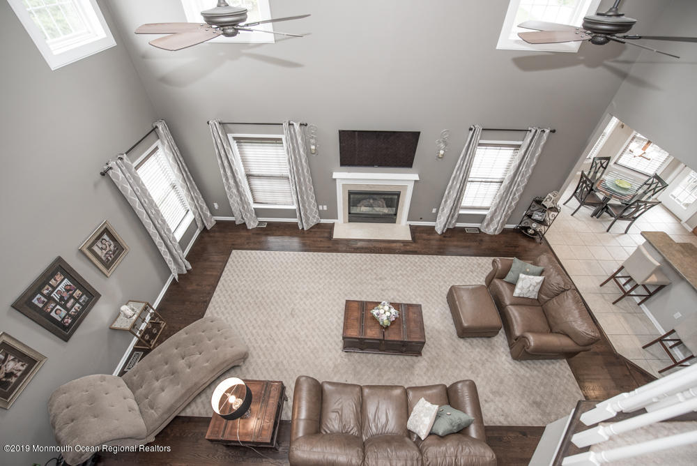 11 Round Hill Road Jackson, NJ 08527 - Photo 37 of 69 a living room with furniture and a flat screen tv