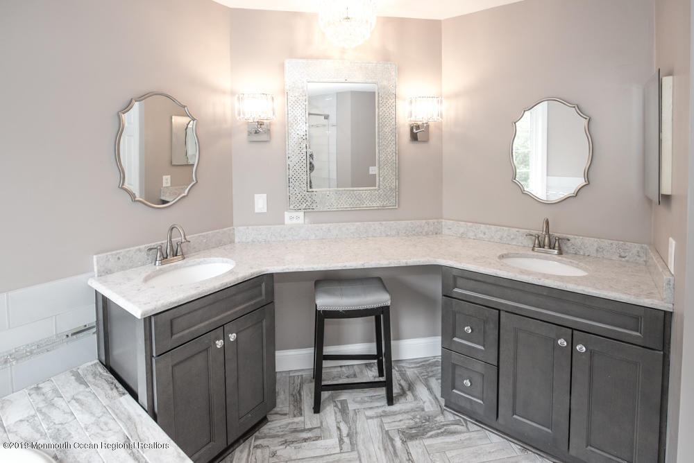 11 Round Hill Road Jackson, NJ 08527 - Photo 43 of 69 a bathroom with a double vanity sink and a mirror