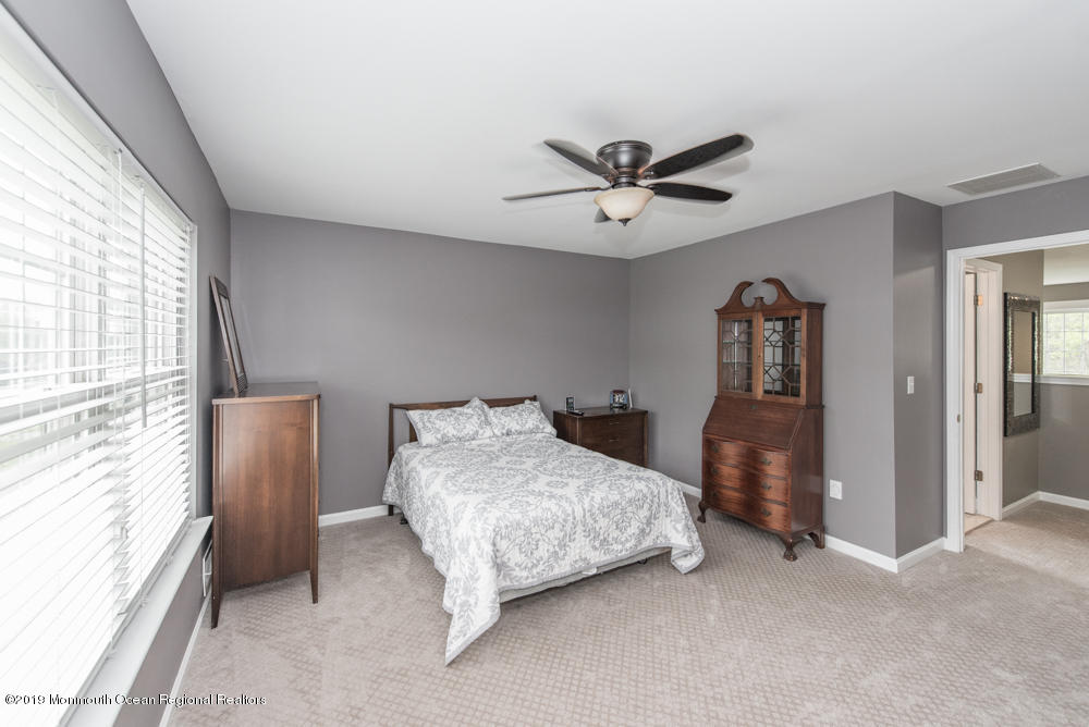 11 Round Hill Road Jackson, NJ 08527 - Photo 50 of 69 a bedroom with a bed and a large window
