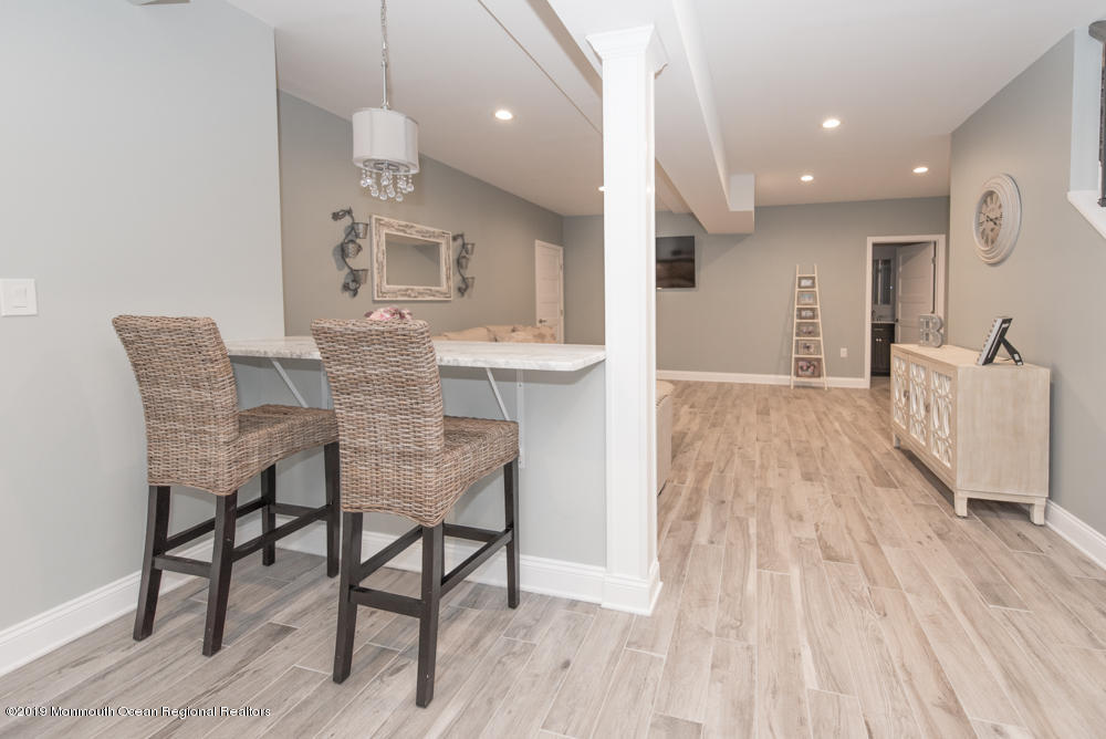 11 Round Hill Road Jackson, NJ 08527 - Photo 51 of 69 a dining room with furniture and wooden floor