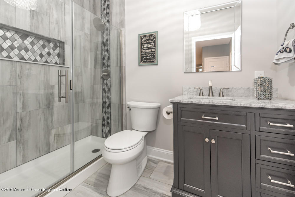 11 Round Hill Road Jackson, NJ 08527 - Photo 52 of 69 a bathroom with a granite countertop sink toilet and shower