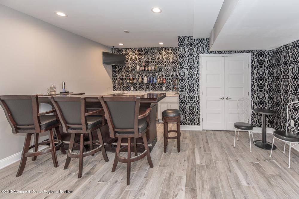 11 Round Hill Road Jackson, NJ 08527 - Photo 53 of 69 a view of a dining room with furniture and wooden floor