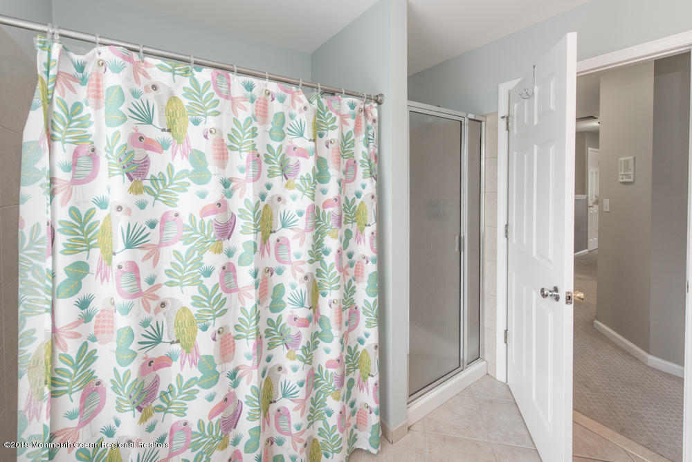 11 Round Hill Road Jackson, NJ 08527 - Photo 65 of 69 a bathroom with a shower curtain