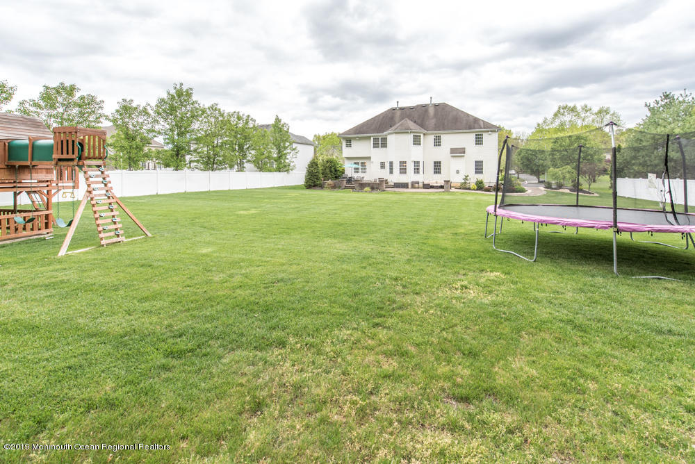 11 Round Hill Road Jackson, NJ 08527 - Photo 66 of 69 a view of a house with a big yard and large trees