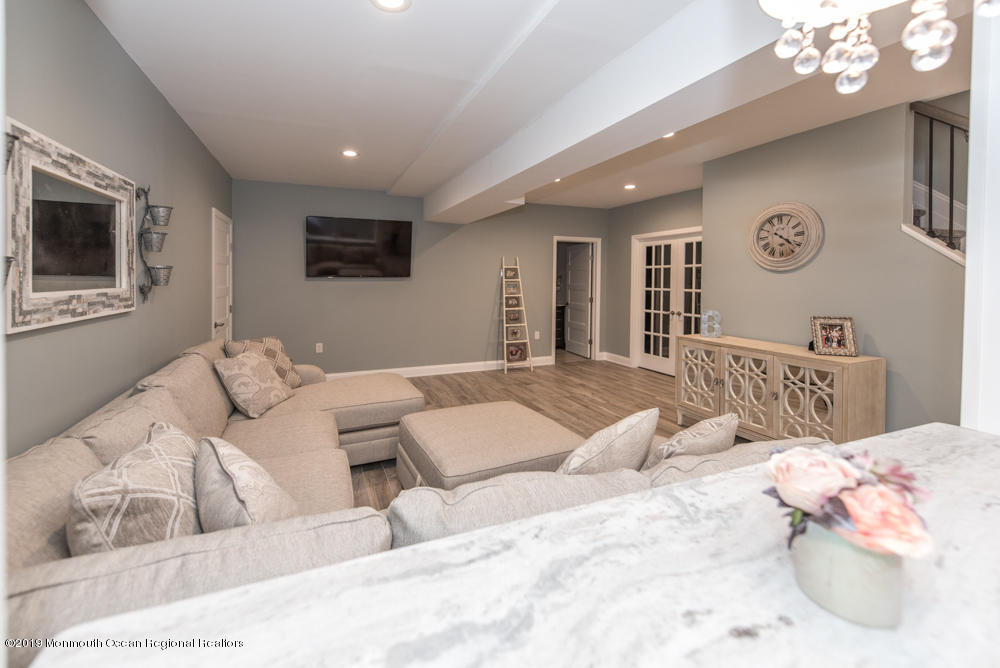 11 Round Hill Road Jackson, NJ 08527 - Photo 8 of 69 a bedroom with a large bed and a couch