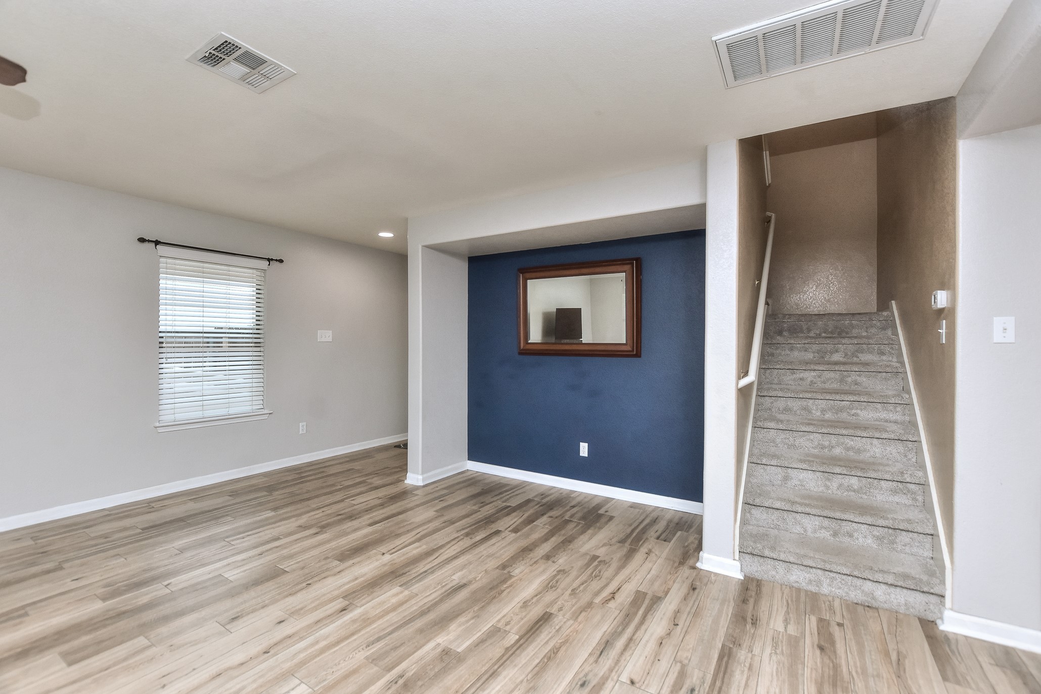 74 Jan Lane Georgetown, TX 78626 - Photo 21 of 31 a view of a livingroom with wooden floor and a ceiling fan