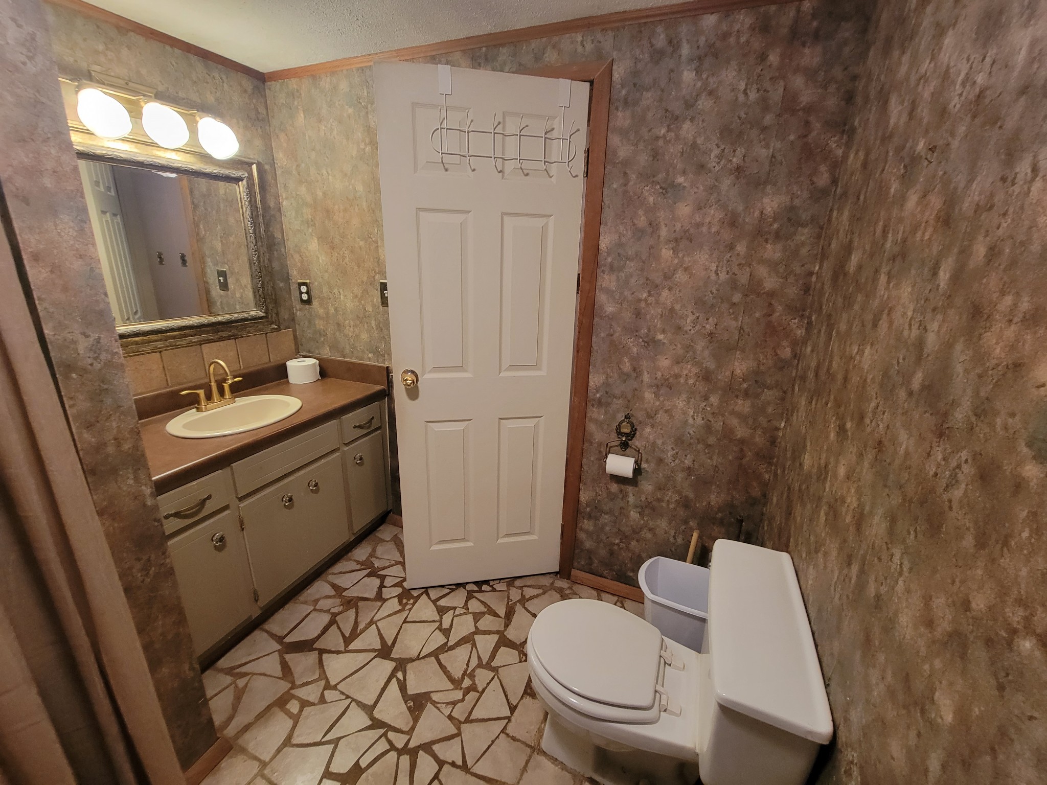 2992 Gum Creek Road Decherd, TN 37324 - Photo 14 of 25 a bathroom with a granite countertop toilet sink and mirror