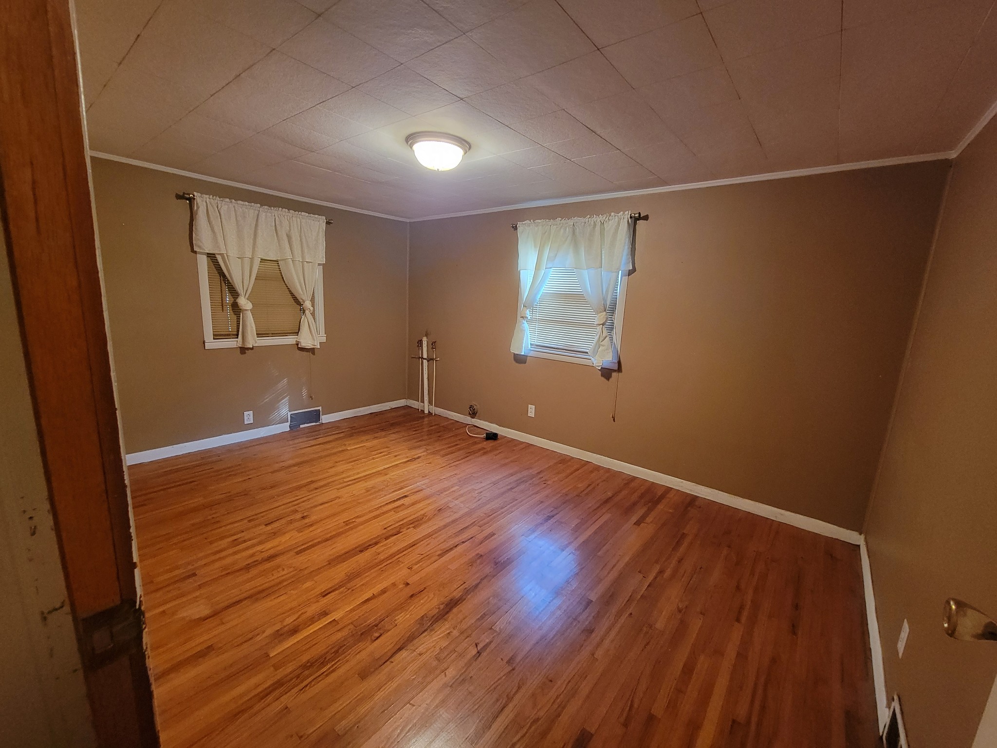 2992 Gum Creek Road Decherd, TN 37324 - Photo 16 of 25 an empty room with wooden floor and windows