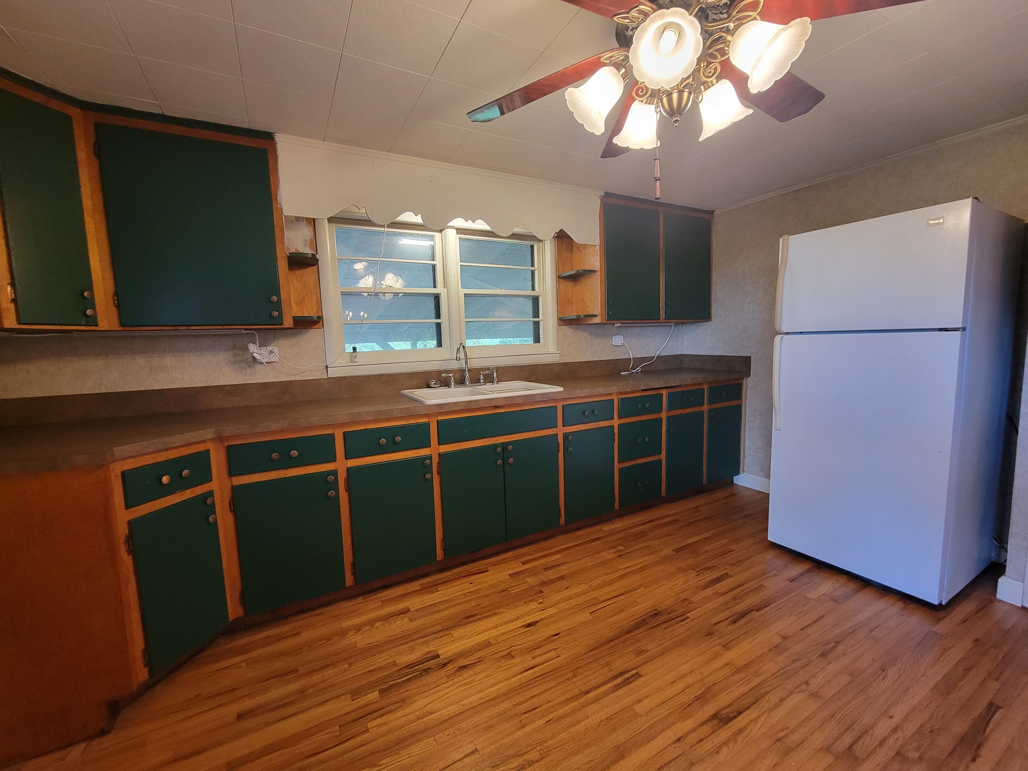 2992 Gum Creek Road Decherd, TN 37324 - Photo 10 of 25 a kitchen with stainless steel appliances granite countertop a sink a microwave oven and a refrigerator