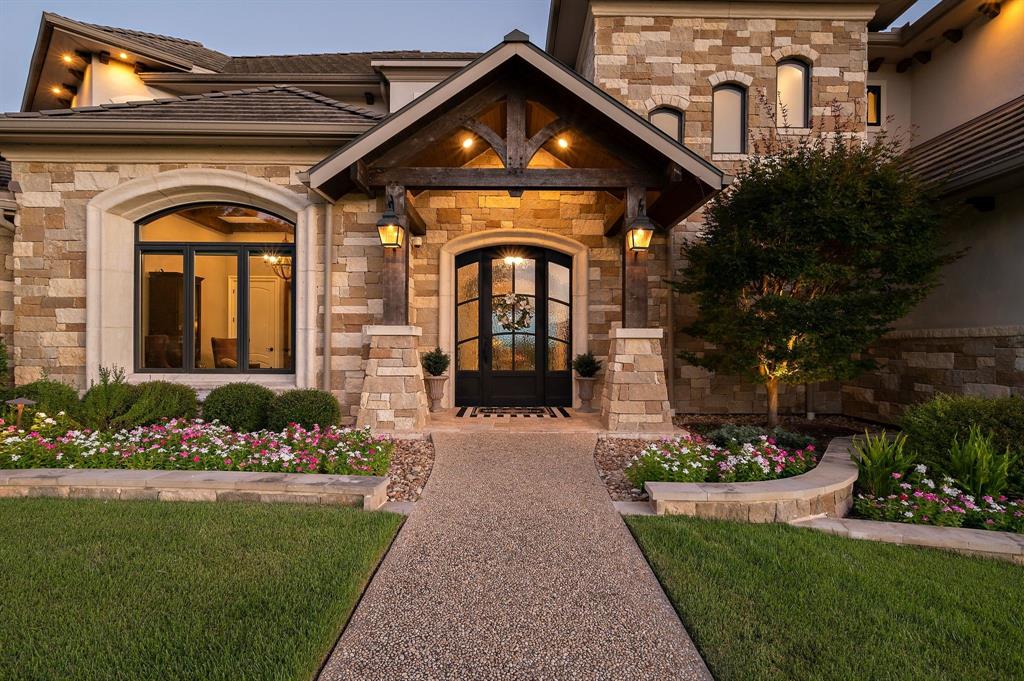 325 River Ridge Spring Branch, TX 78070 - Photo 14 of 40 a front view of a house with a garden