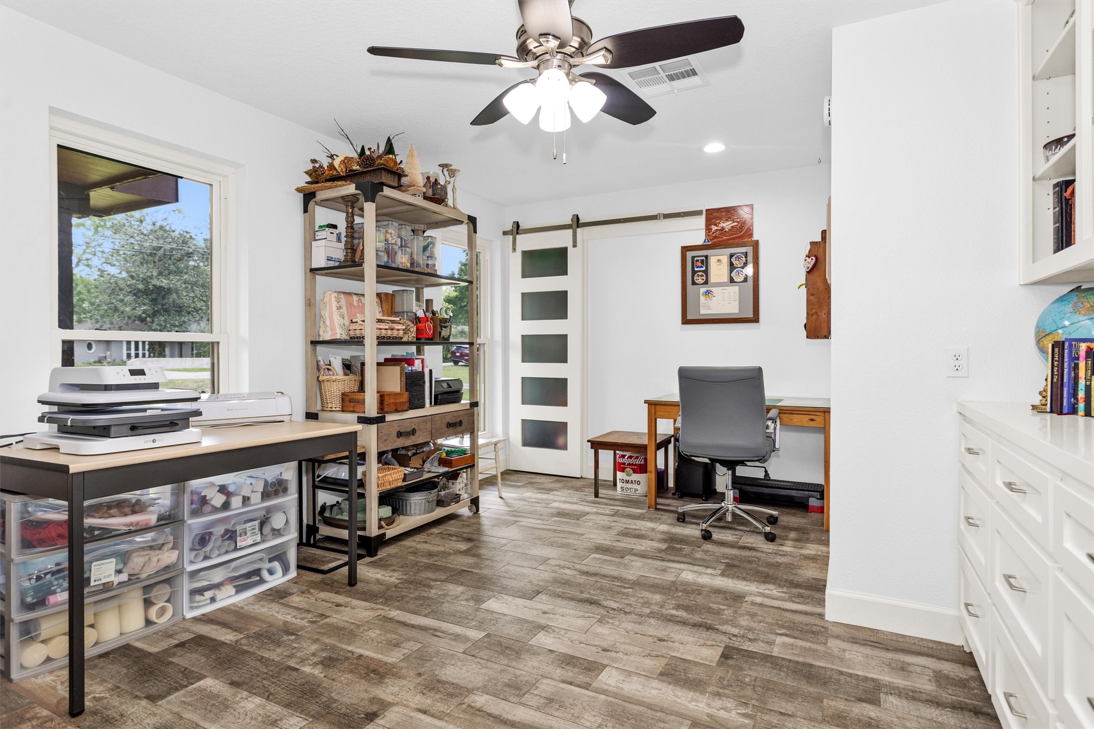 4402 Spears Road Manvel, TX 77578 - Photo 14 of 38 a view of a workspace with furniture and a window