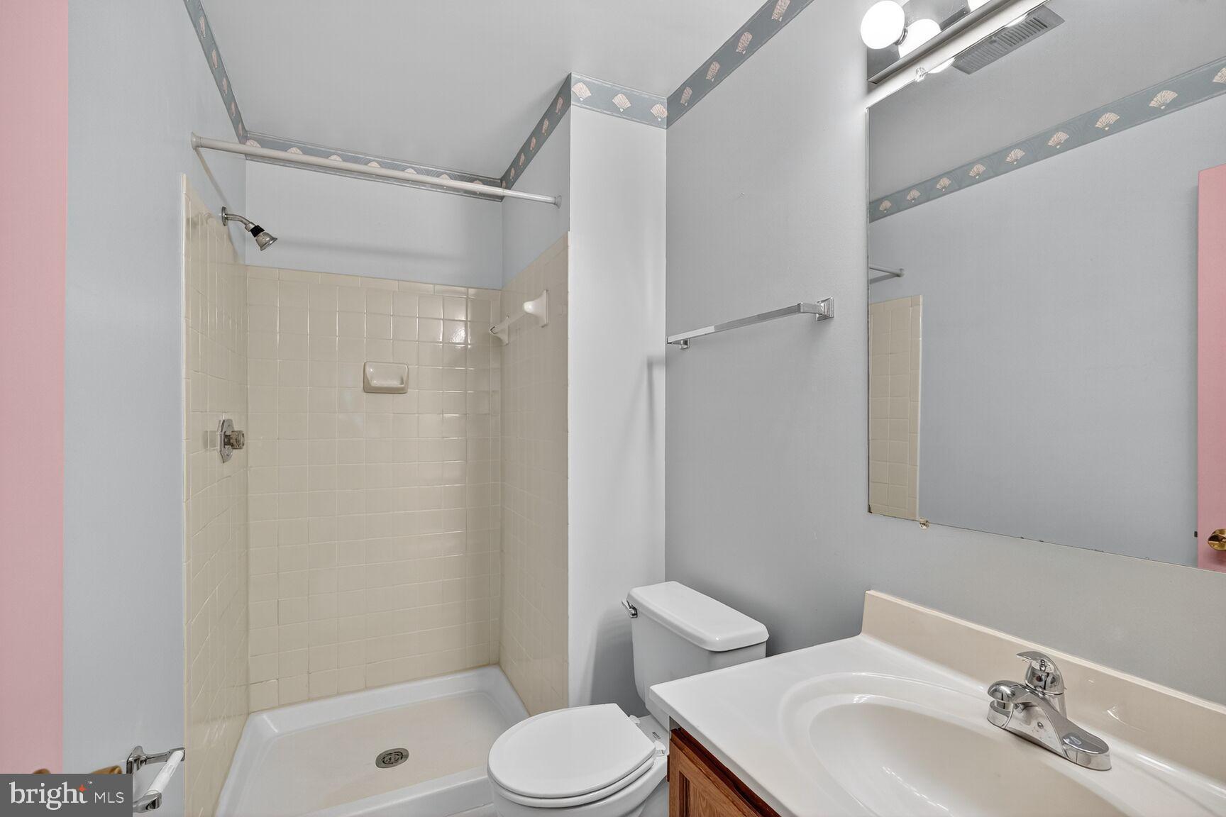 2890 Schoolhouse Circle Silver Spring, MD 20902 - Photo 14 of 23 a bathroom with a sink toilet and shower