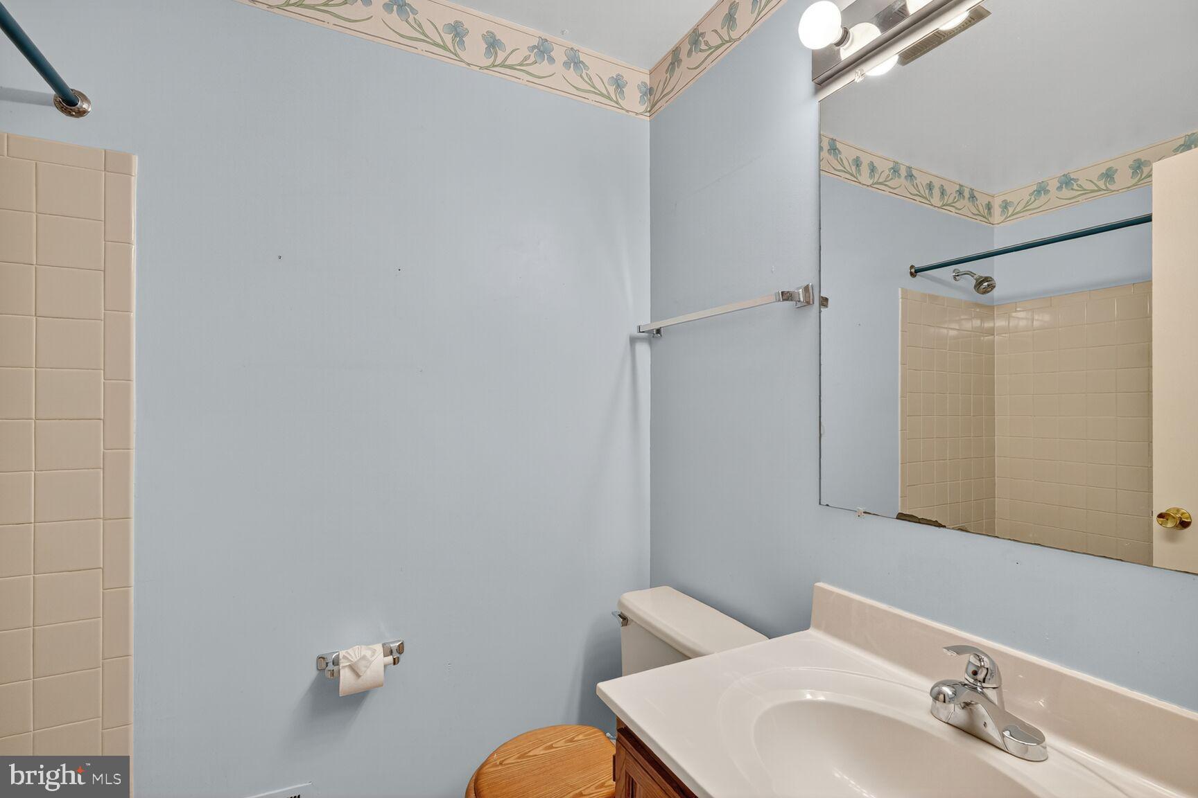 2890 Schoolhouse Circle Silver Spring, MD 20902 - Photo 17 of 23 a bathroom with a sink toilet and shower
