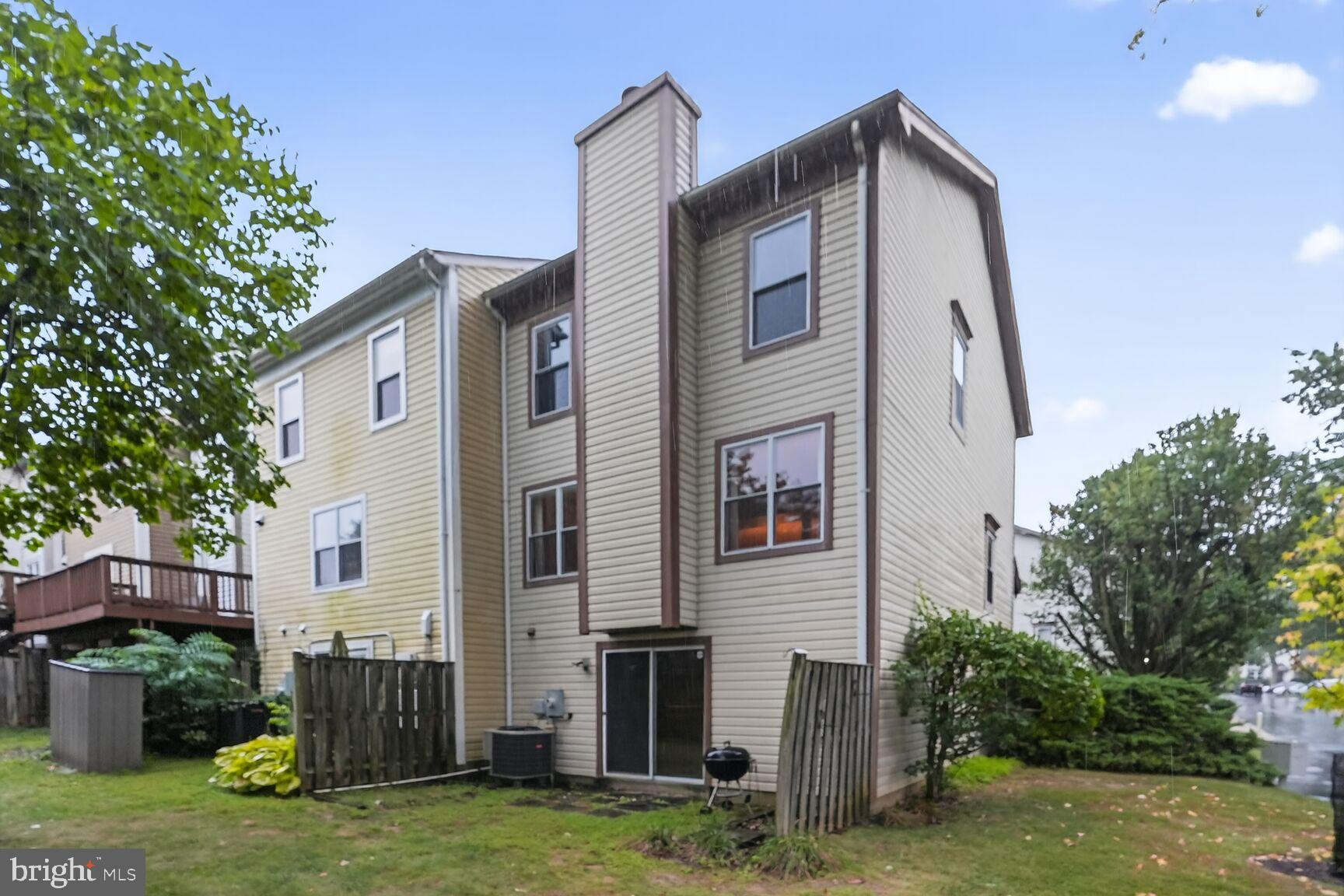 2890 Schoolhouse Circle Silver Spring, MD 20902 - Photo 22 of 23 a front view of a house with garden