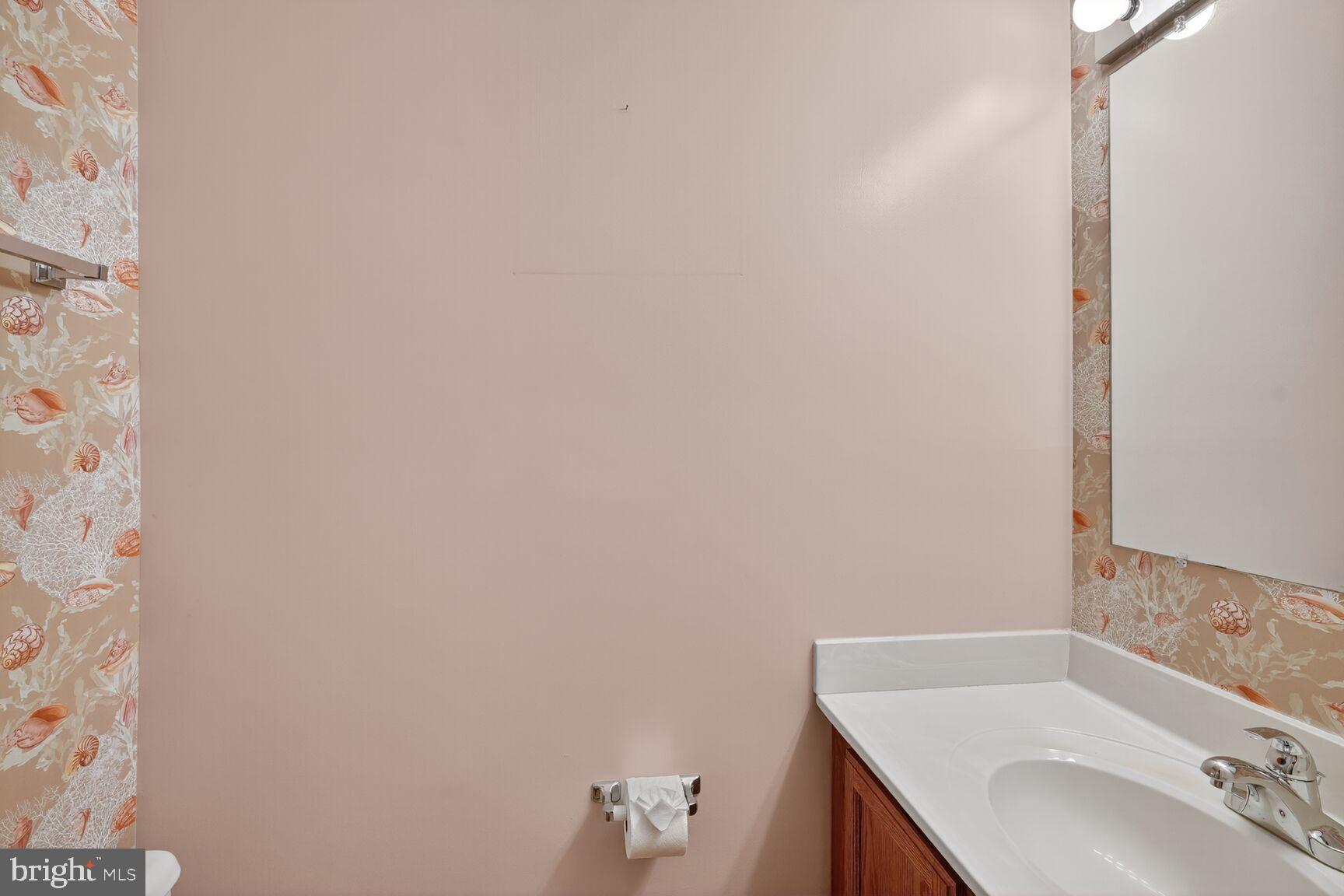 2890 Schoolhouse Circle Silver Spring, MD 20902 - Photo 6 of 23 a bathroom with a sink and a vanity