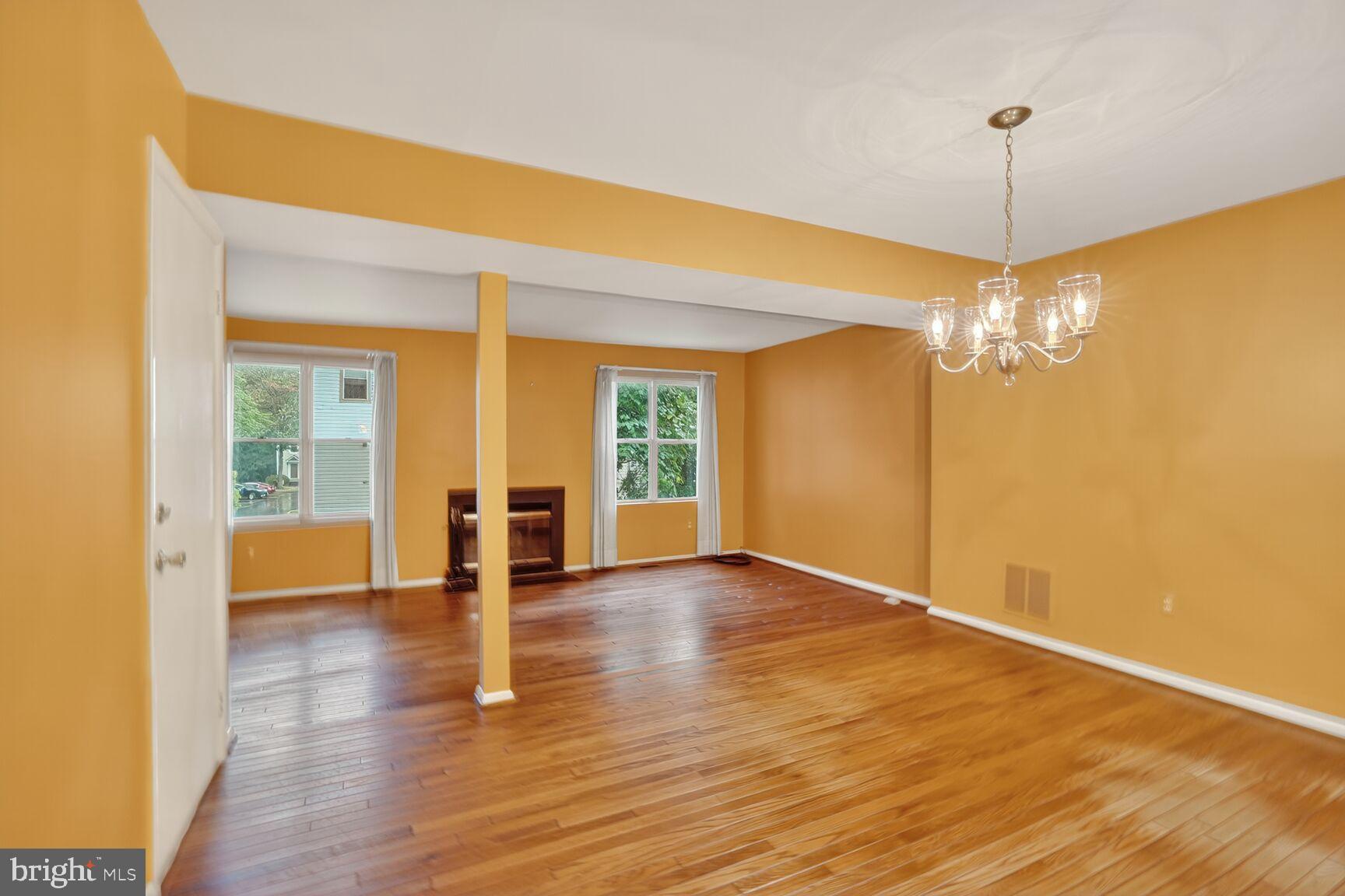 2890 Schoolhouse Circle Silver Spring, MD 20902 - Photo 9 of 23 a view of an empty room with window and wooden floor