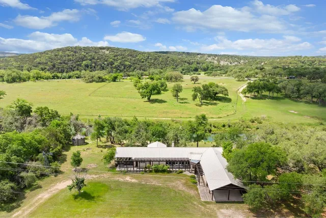 a view of a lake with houses in the back