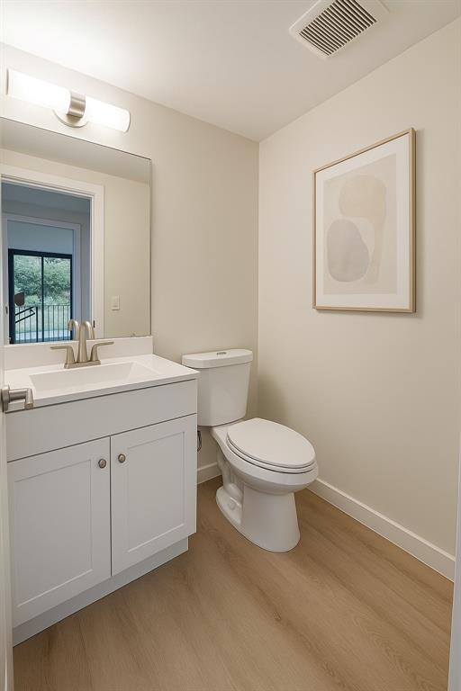 850 Southwest 133rd Terrace, Unit 205B Pembroke Pines, FL 33027 - Photo 7 of 7 a bathroom with a toilet a sink and mirror