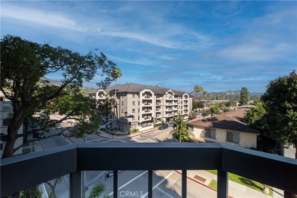 222 Monterey Road, Unit 206 Glendale, CA 91206 - Photo 11 of 22 a view of a balcony with chairs and a table