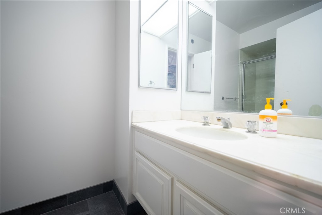 222 Monterey Road, Unit 206 Glendale, CA 91206 - Photo 14 of 22 a bathroom with a sink and a mirror