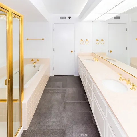 a bathroom with a bathtub and a shower