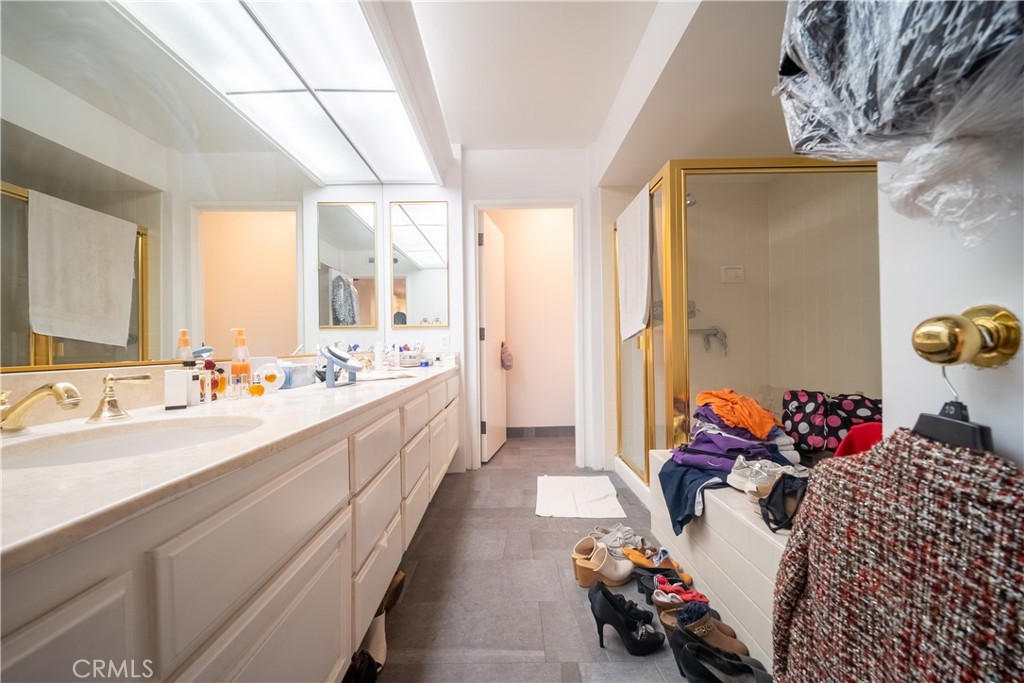 222 Monterey Road, Unit 206 Glendale, CA 91206 - Photo 9 of 22 a large white room with a large mirror and sink