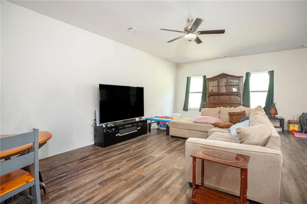 635 Meadows Farm Way Monroe, GA 30655 - Photo 8 of 36 a living room with furniture and a flat screen tv