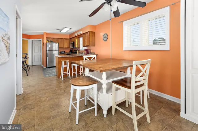 a dining room with furniture and window