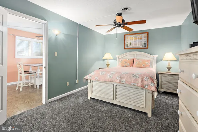 a room with a bed and a chandelier