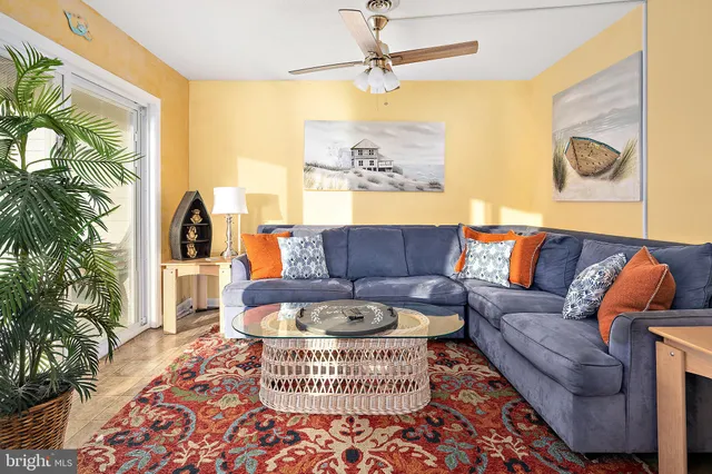 a living room with furniture and a rug
