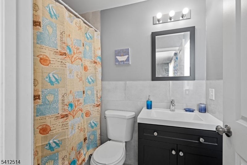 73 Winans Avenue, Unit 2 Newark, NJ 07108 - Photo 2 of 13 a bathroom with a sink toilet and shower