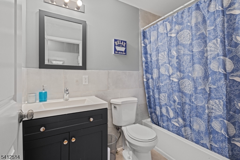 73 Winans Avenue, Unit 2 Newark, NJ 07108 - Photo 3 of 13 a bathroom with a sink and a toilet