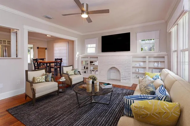 a living room with furniture fireplace and a flat screen tv