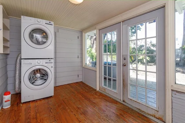 a view of a bedroom with washer and dryer