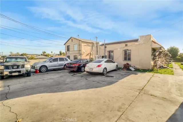 a view of cars parked in front of a building