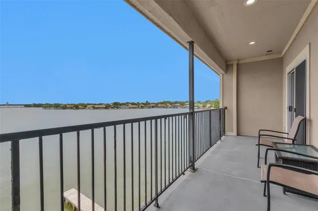 a view of a balcony with furniture