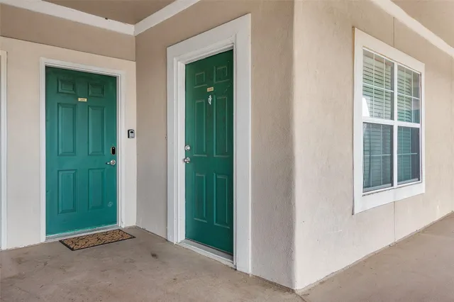 an empty room with closet and a window