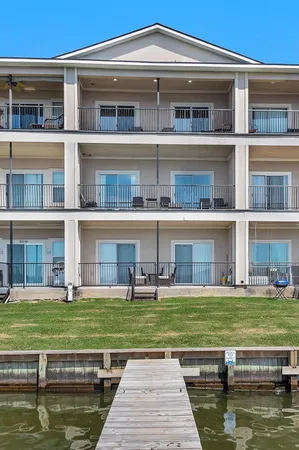 a house with swimming pool in front of it