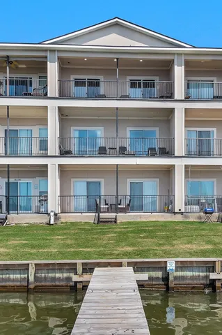 a house with swimming pool in front of it