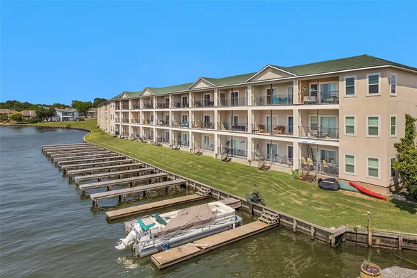 a view of a house with swimming pool and sitting area