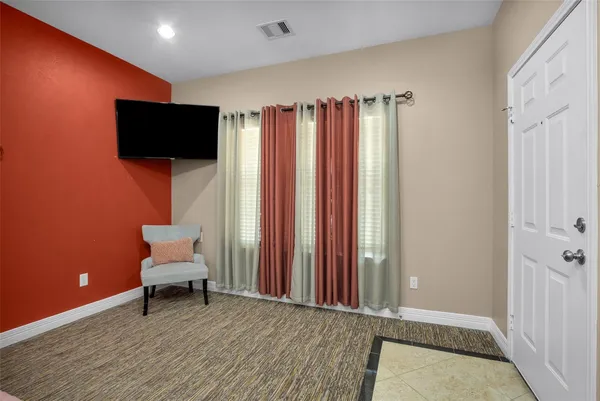 a view of a livingroom with furniture and a window