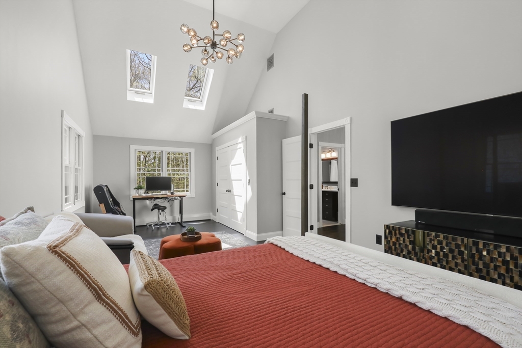 52 Fales Road Plainville, MA 02762 - Photo 34 of 41 a bedroom with a bed and a flat screen tv