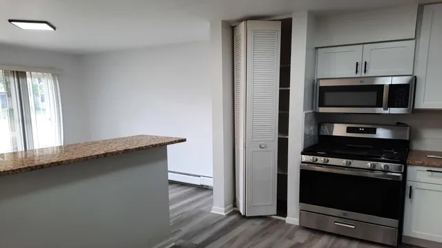 a kitchen with a stove and a microwave