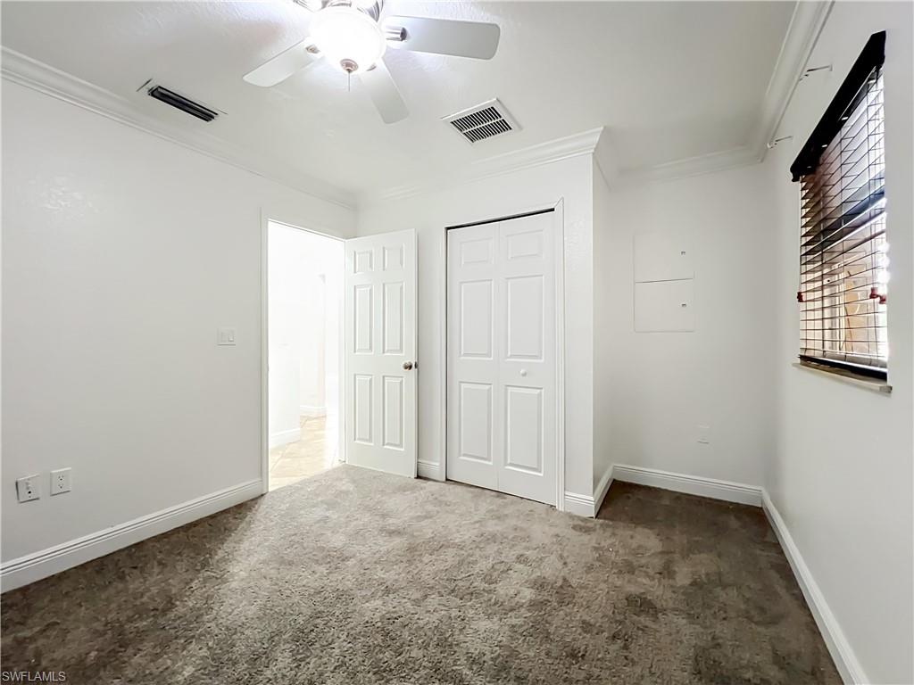 4210 South Hiawassee Road Orlando, FL 32835 - Photo 21 of 49 an empty room with windows and fan