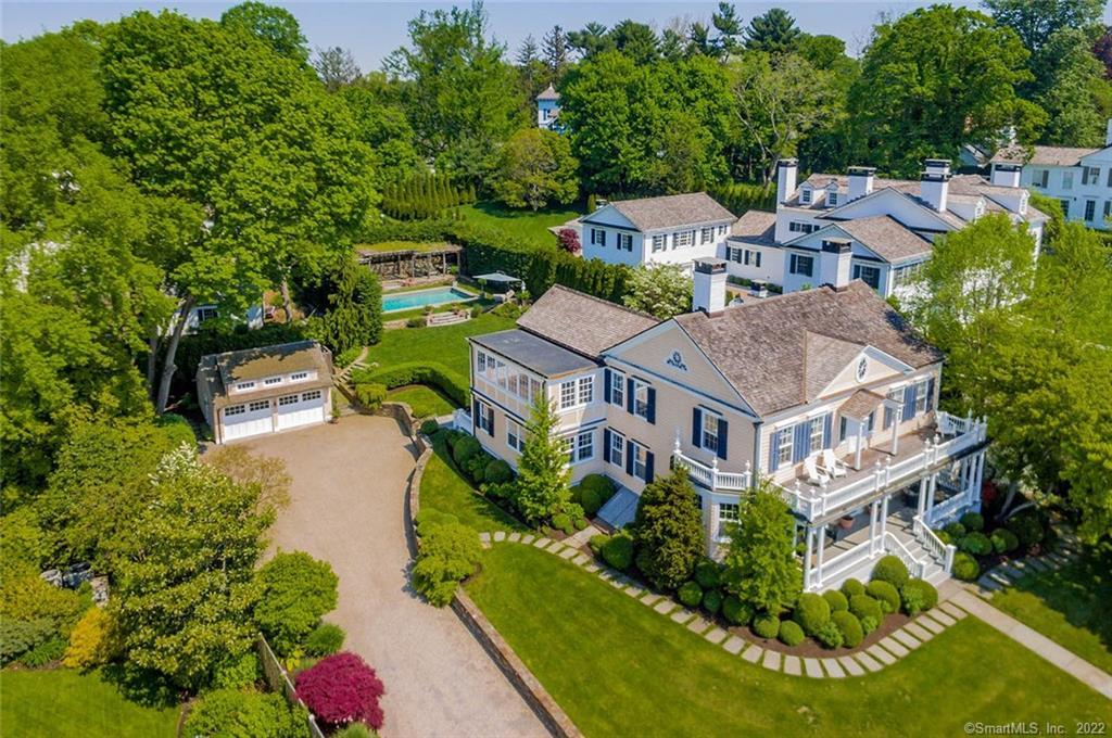 an aerial view of multiple houses with yard
