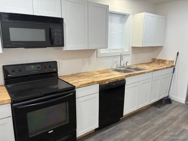 a kitchen with a stove and a microwave
