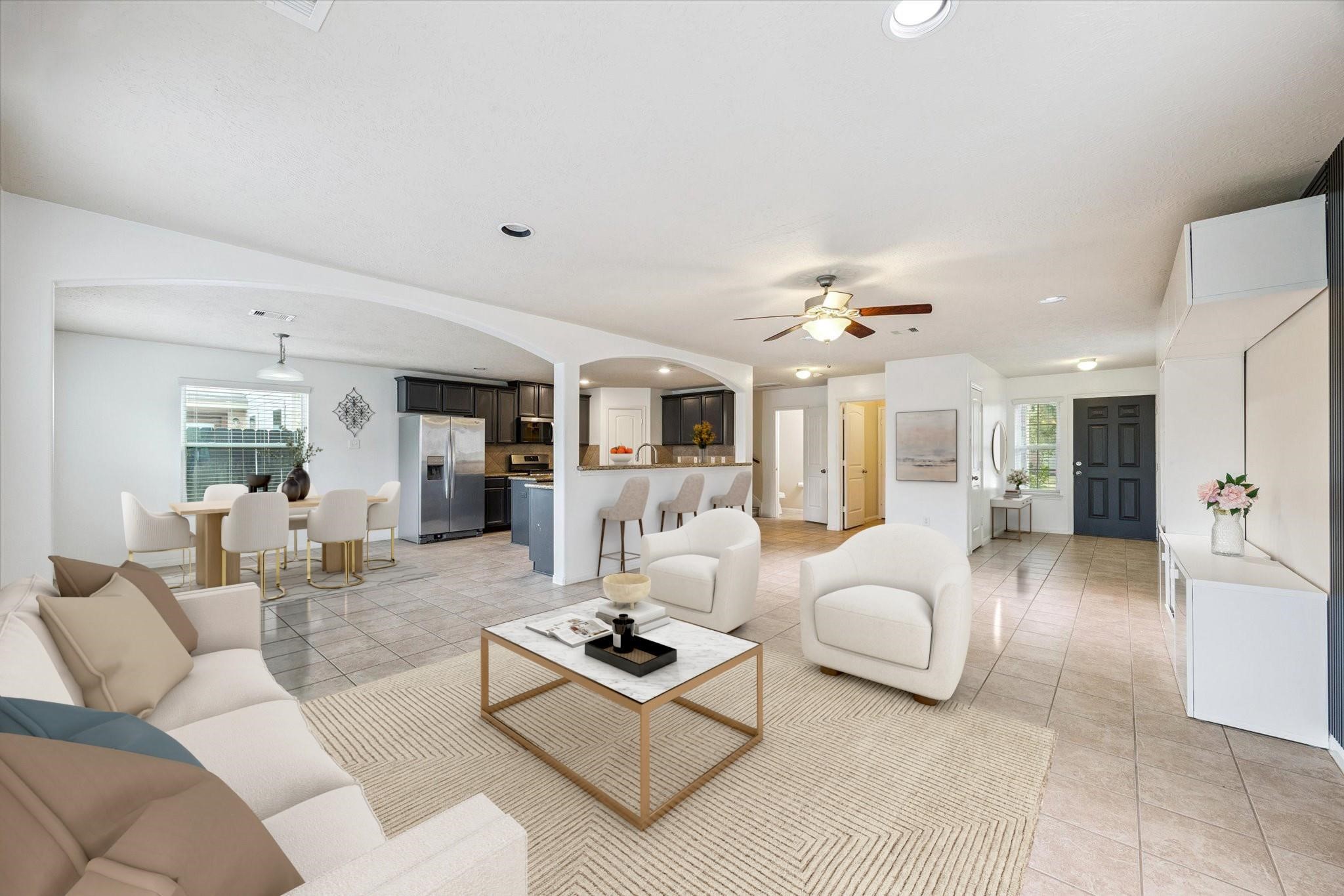 a living room with furniture and a chandelier