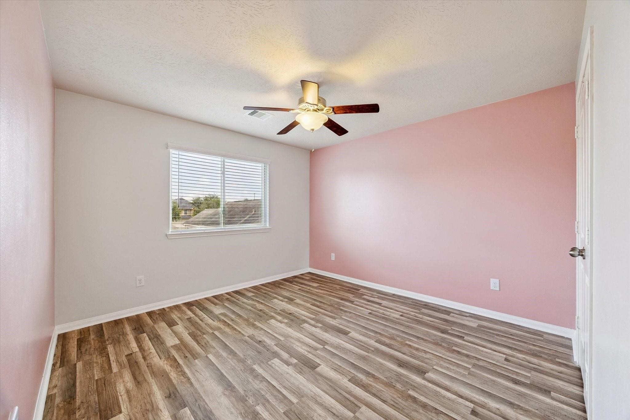 11718 Red Hummingbird Drive Houston, TX 77047 - Photo 11 of 13 a view of an empty room with a window